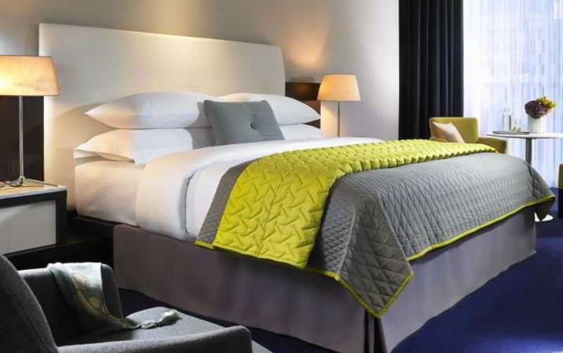 Anantara The Marker Dublin- A Leading Hotel Of The World Exterior photo A bed with a bed skirt
